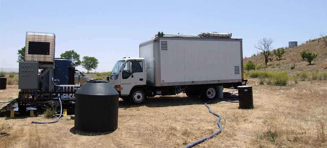 Portable DPE System with Water Treatment Trailer at Remote Hydrocarbon Site